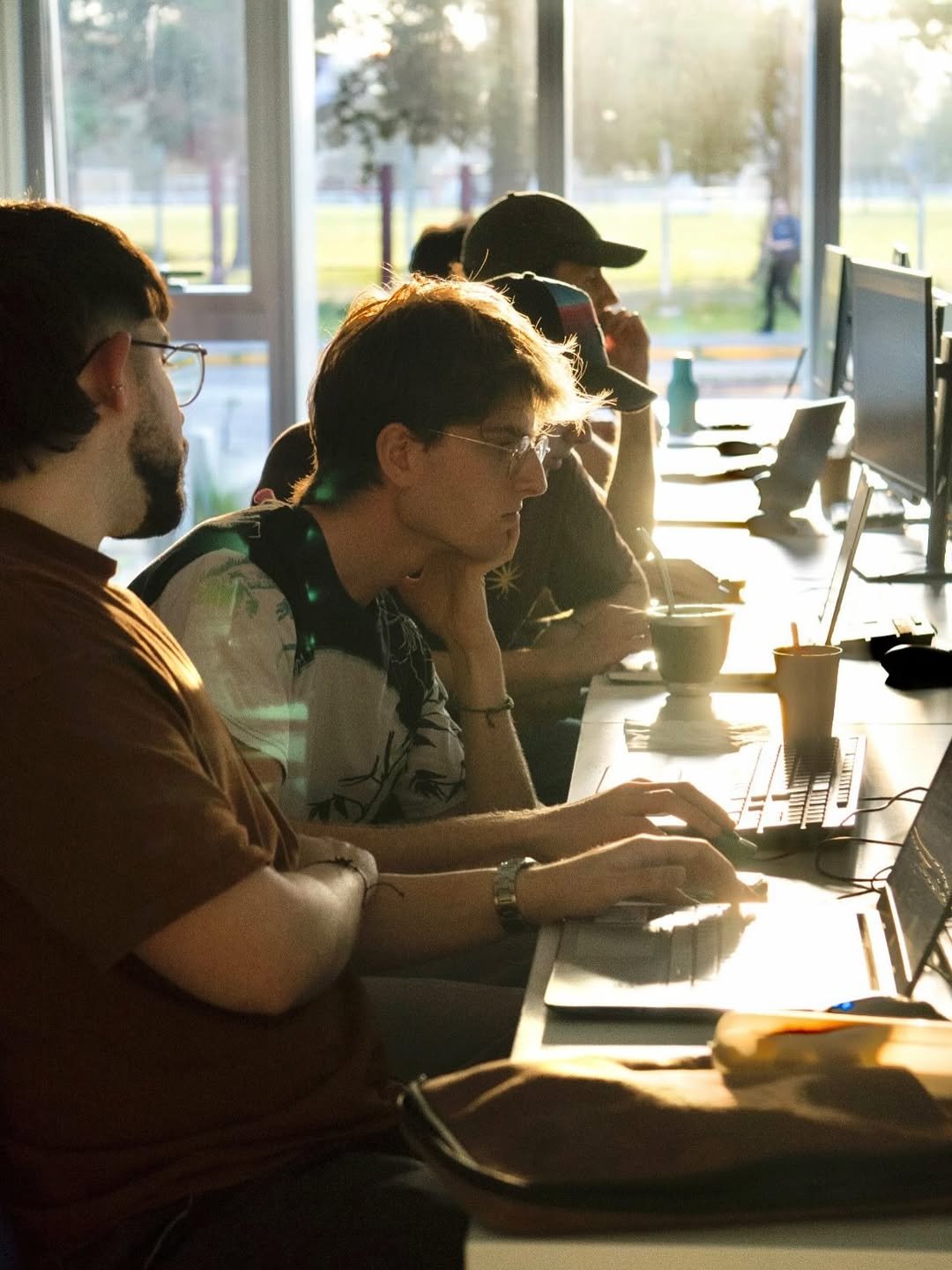Vibe coding workshop participants during golden hour